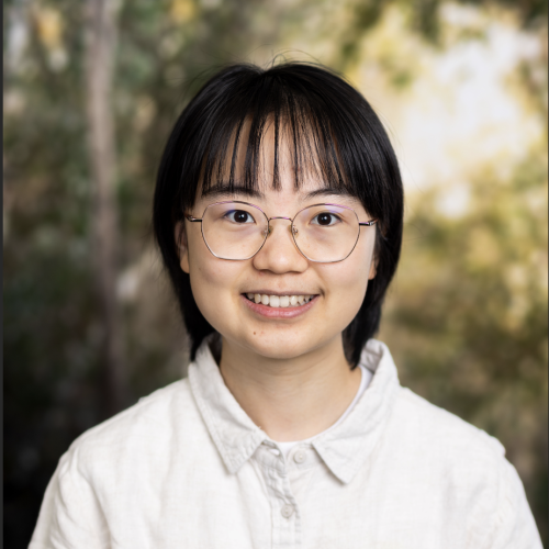 Headshot of postdoctoral research associate Yuyao Wang smiling in a white collared shirt