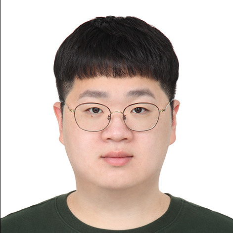 A front-facing headshPostdoc Jaewon Lim with short black hair and straight bangs, wearing thin-rimmed metal glasses and a dark green crewneck sweatshirt against a plain white background.