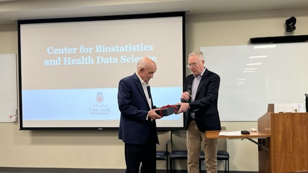 Joe Hogan, giving award to Constantine Gatsonis